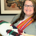 Megan Ellis, Indigenous Program Coordinator, has been leading the KAIROS Blanket Exercise with groups of staff from The Ottawa Hospital. She wears her red sash to show her Métis heritage.